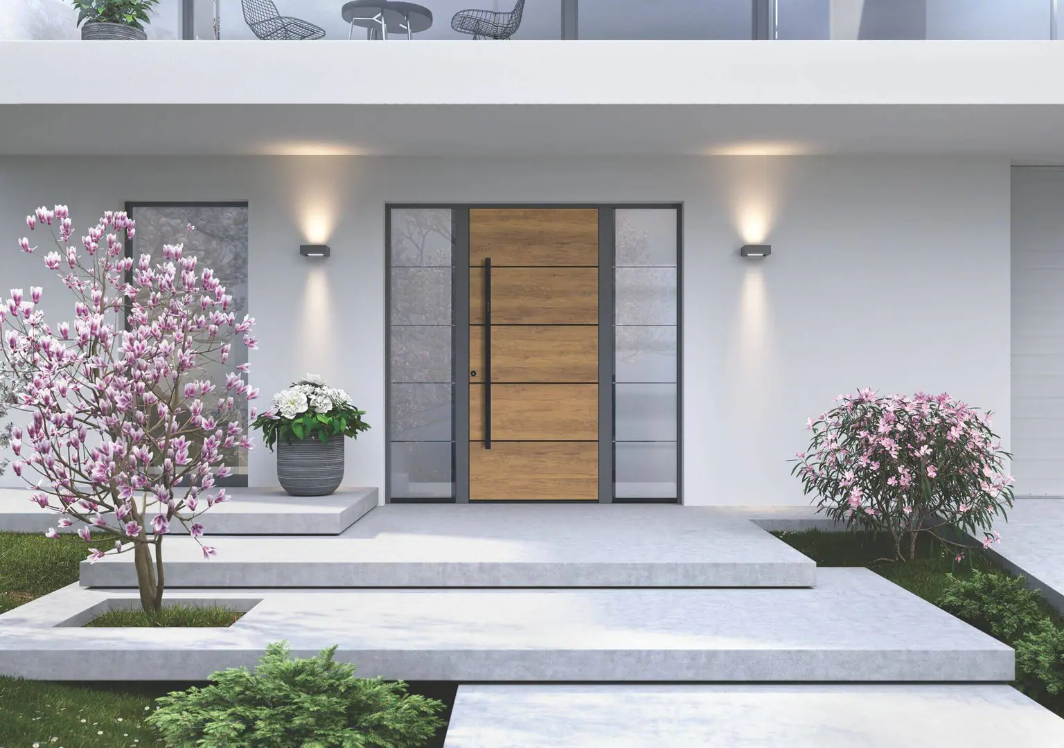 Vhodna vrata Inotherm – pomlad: Bela fasada, magnolija, vrata v dekorju hrasta s stransko obsvetlobo.